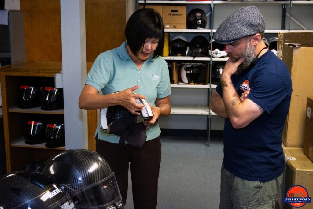 Hong Zhang shows me collapsed EPS foam in a cutaway model of a helmet.