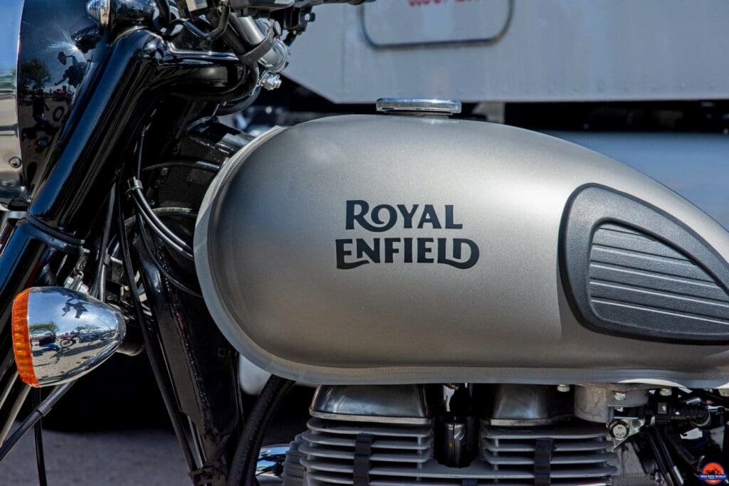 The Royal Enfield brand name painted on a gas tank.