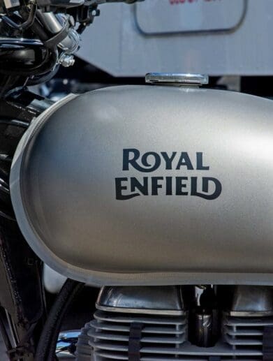 The Royal Enfield brand name painted on a gas tank.