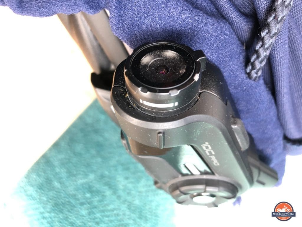 Tiny dust particles trapped under the camera glass in my Sena 10C Pro