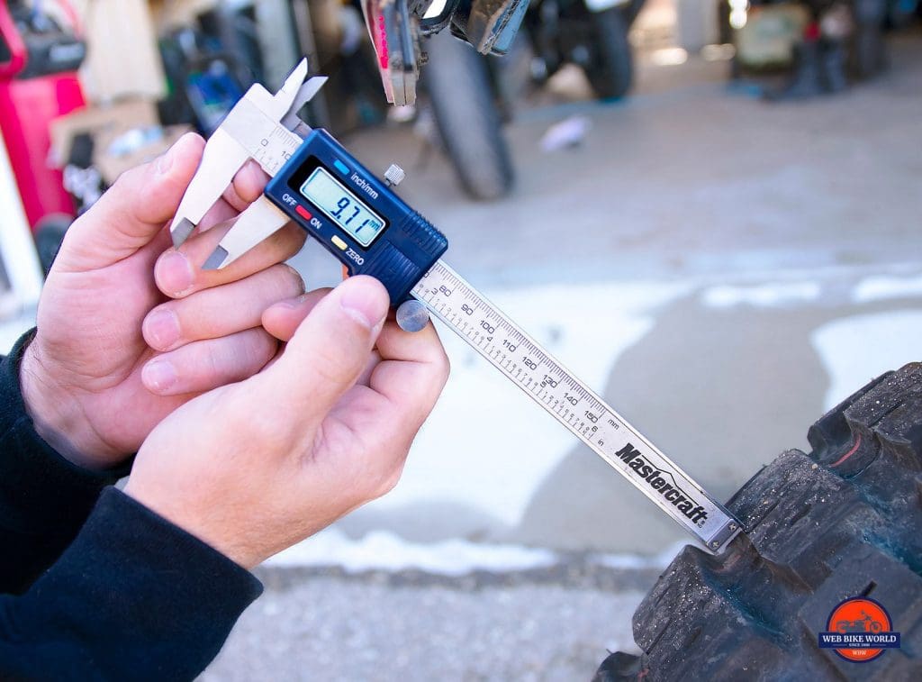 Rear tire tread depth measurement on the Motoz Tractionator Adventure tires after 3700 kms.