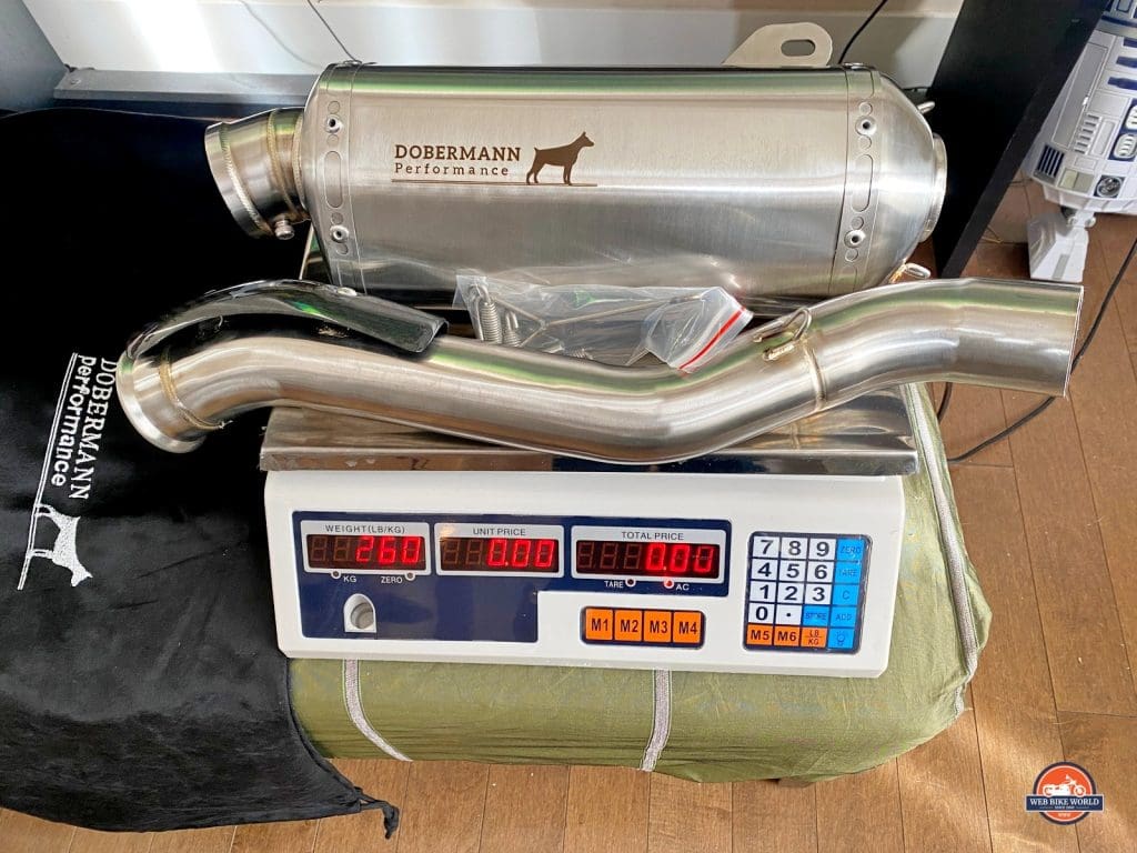 The Dobermann Performance exhaust for a 790 Adventure on a scale