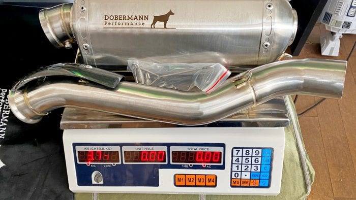 The Dobermann Performance exhaust for a 790 Adventure on a scale