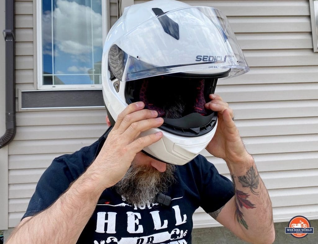 Donning the Sedici Strada II helmet