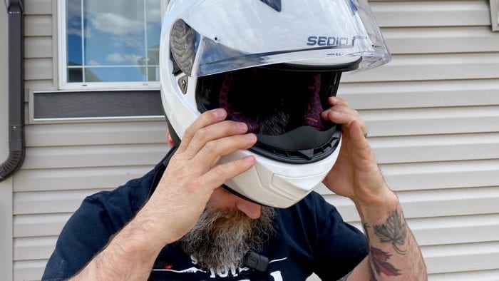 Donning the Sedici Strada II helmet