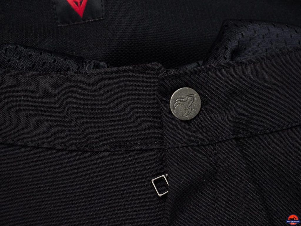 Closeup of main button after replacement with one I had on hand from other riding pants