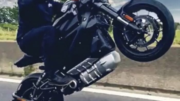 A rider doing a wheelie with the LiveWire A rider doing a wheelie with the LiveWire