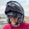 The Touratech Aventuro Traveller Carbon helmet with sun lens down.