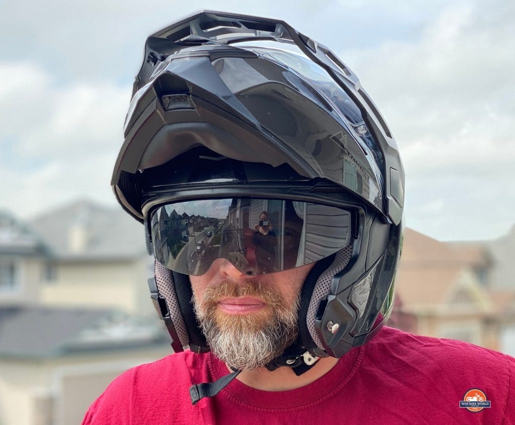 The Touratech Aventuro Traveller Carbon helmet with sun lens down.