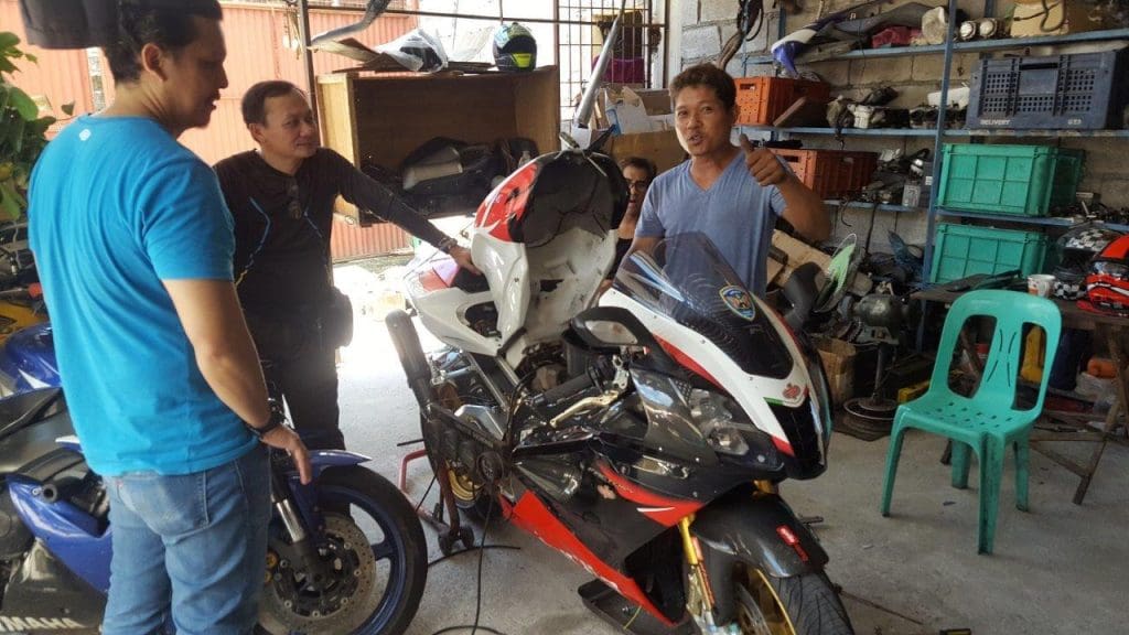 Mechanics working on Aprilia bike