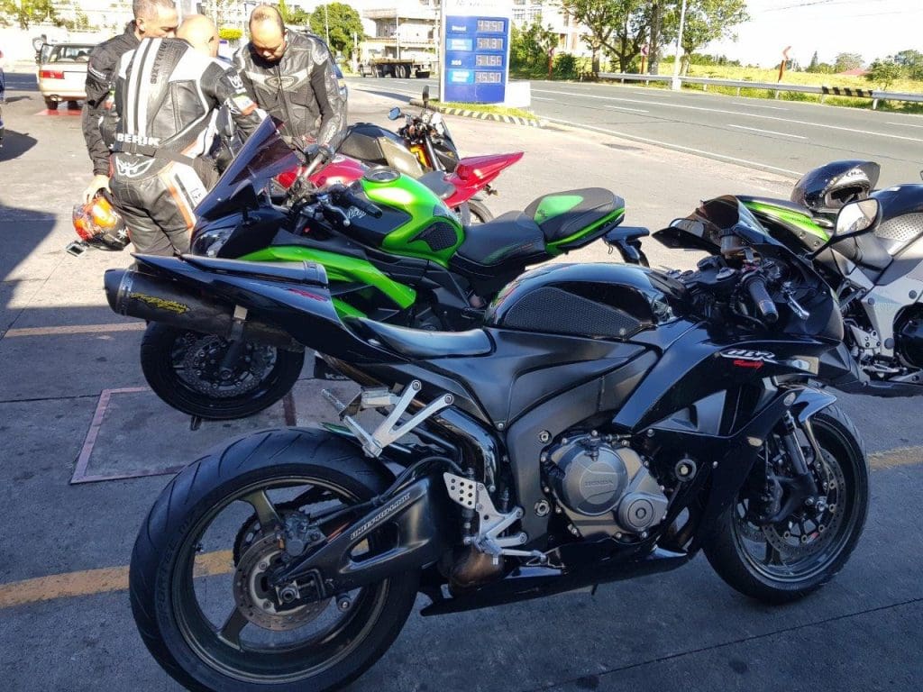 Honda bike parked at gas station