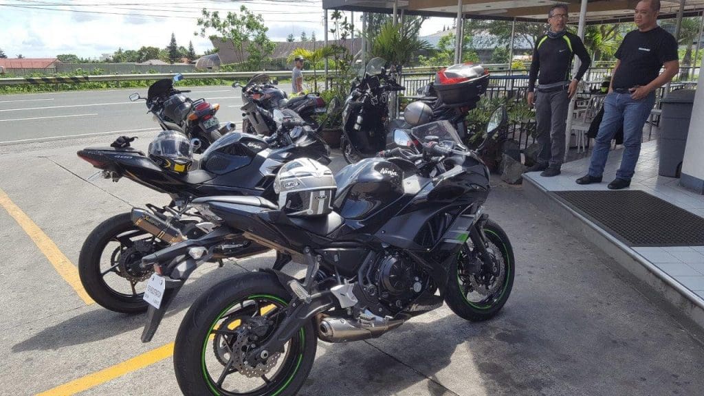 Kawasaki owners admiring their bikes