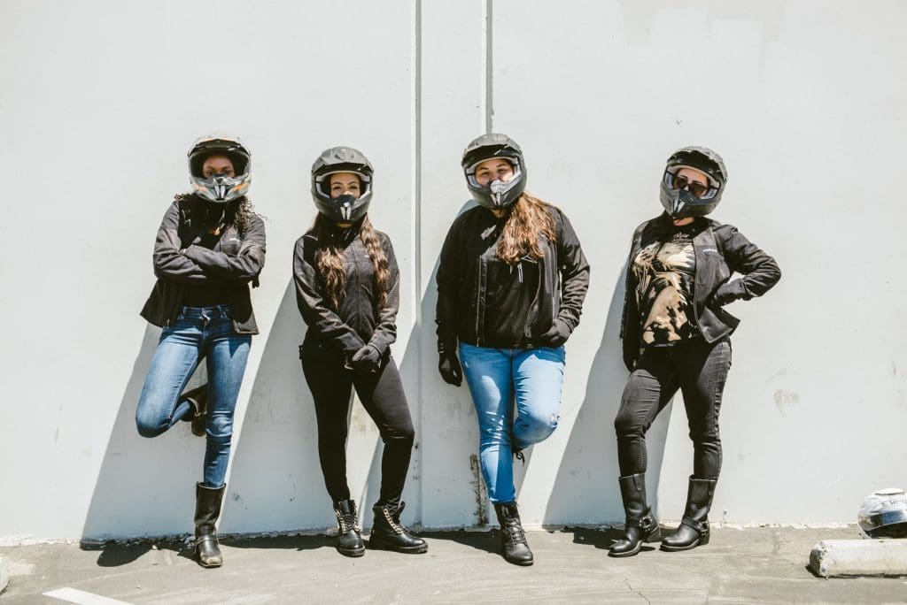 four women in motorcycle gear