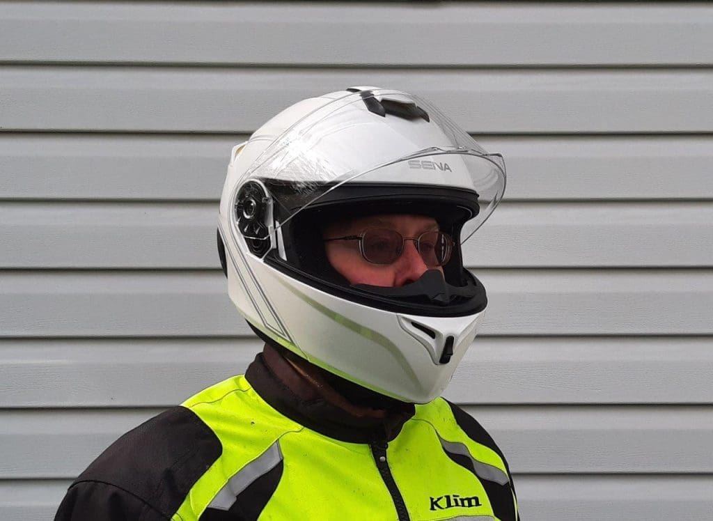 Rider wearing Sena Outrush Modular Helmet