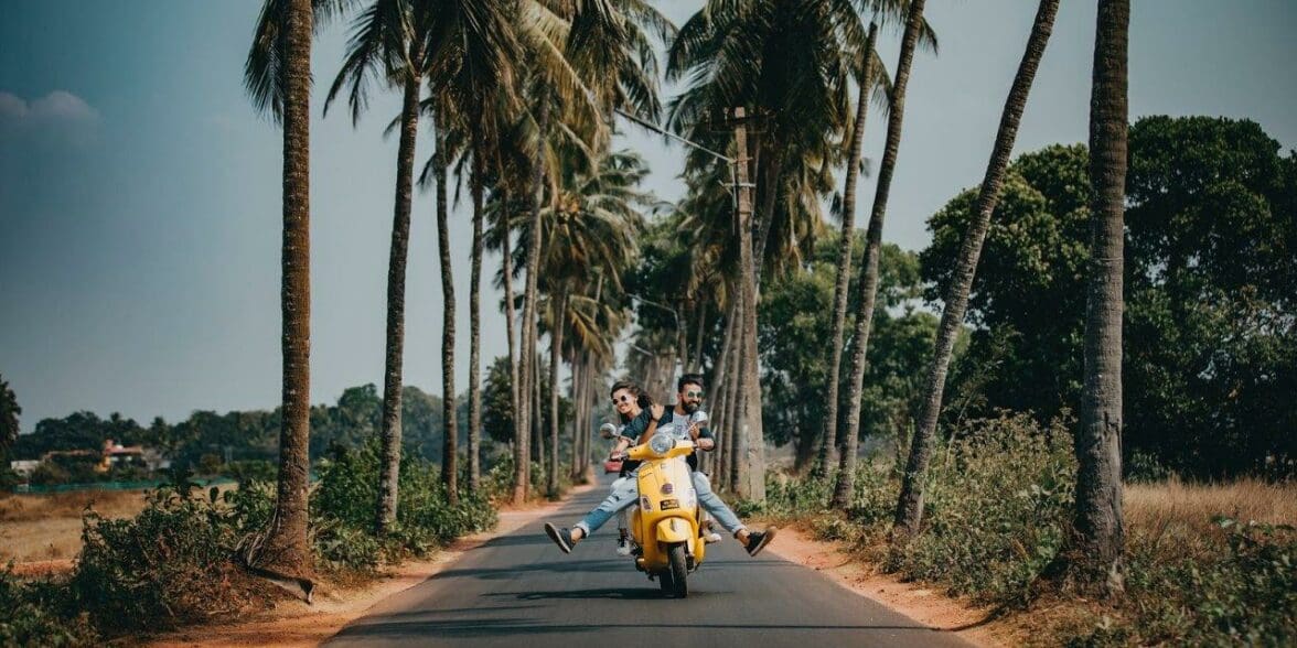 couple riding a scooter