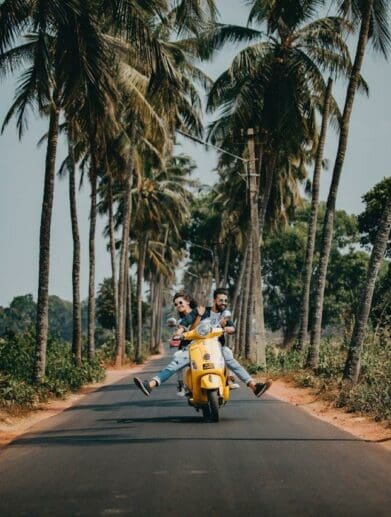 couple riding a scooter