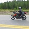 Jim Pruner riding his KTM 790 Adventure while wearing the Shoei Hornet X2 helmet.