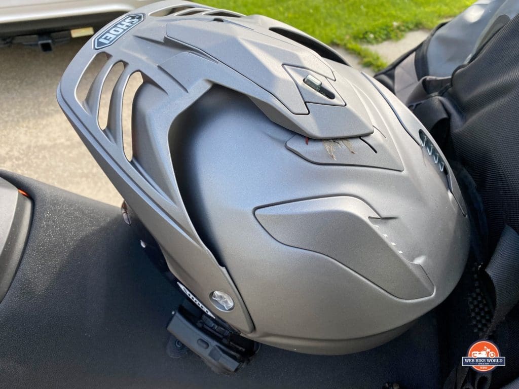 Shoei Hornet X2 helmet with bug stuck to top vent.