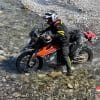 Jim Pruner crossing a stream on his KTM 790 Adventure.