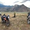 Three adventure motorcycles parked off road in British Columbia.