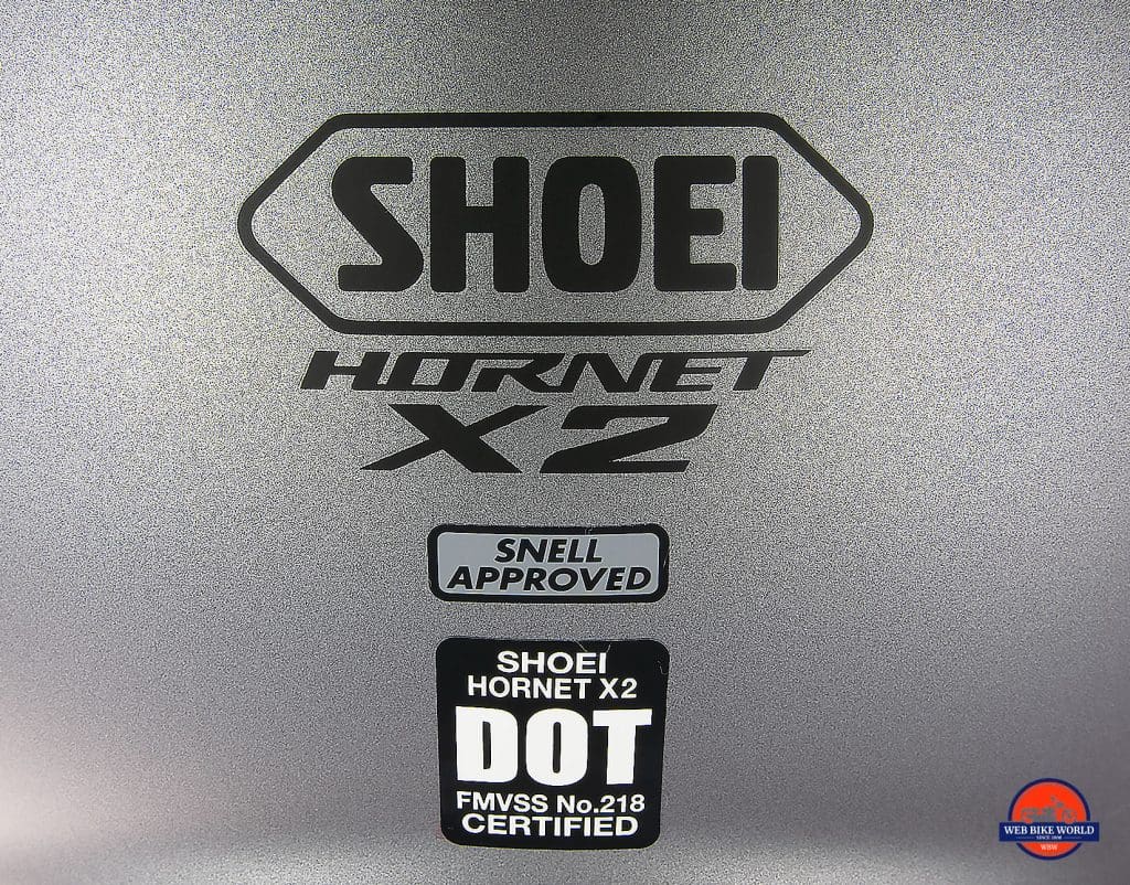 The Snell and DOT stickers on the back of the Shoei Hornet X2.