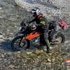 Jim Pruner crossing a stream on a KTM 790 Adventure while wearing the Joe Rocket Canada Whistler Adventure boots.
