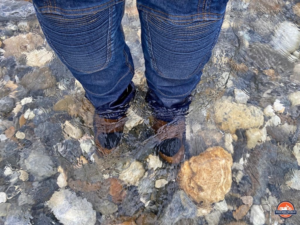 The Joe Rocket Canada Whistler Adventure boots submerged in a stream.