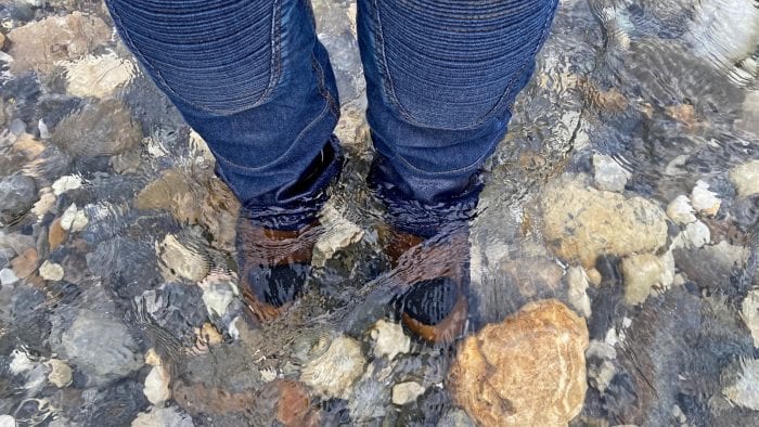 The Joe Rocket Canada Whistler Adventure boots submerged in a stream.