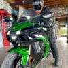The Klim Krios Pro being worn by a rider on a Kawasaki Ninja H2SX SE.