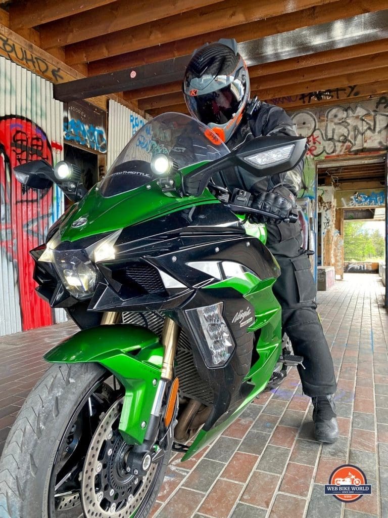 The Klim Krios Pro being worn by a rider on a Kawasaki Ninja H2SX SE.