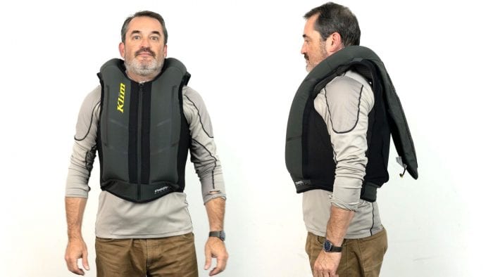 Front and side view of user wearing inflated Klim Ai-1 airbag vest Front and side view of user wearing inflated Klim Ai-1 airbag vest
