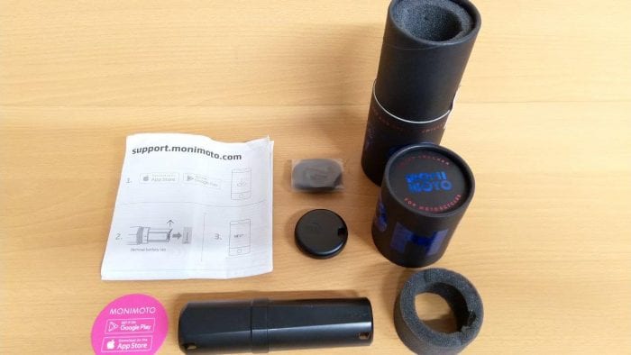 Box contents of Monimoto GPS Tracker laid out on table. Box contents of Monimoto GPS Tracker laid out on table.
