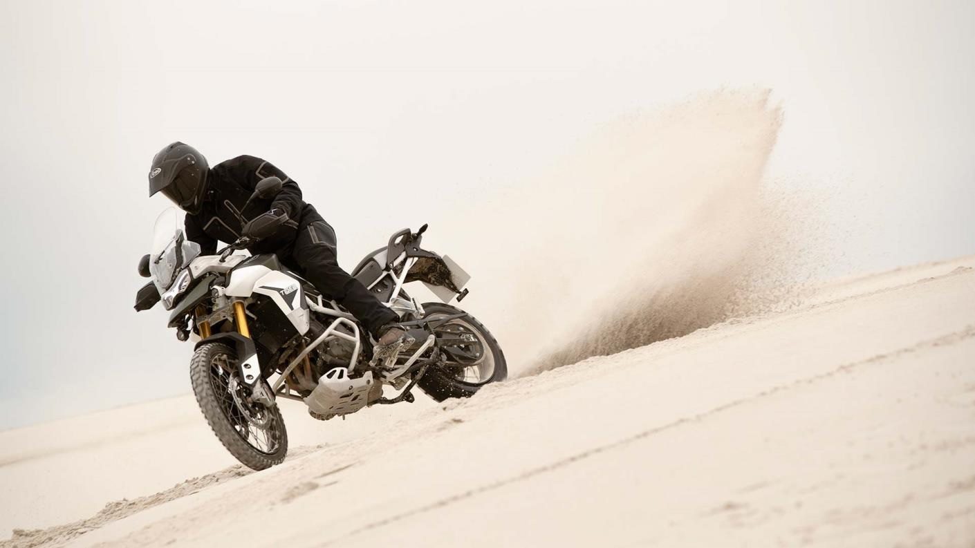 Hero image - Triumph Tiger 900 Rally Pro Riding In The Sand