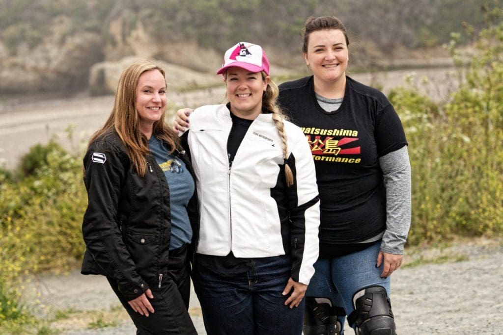 Female riders wearing motorcycle gear