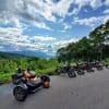 The Can-Am Ryker 900 Rally Edition parked next to other motorcycles