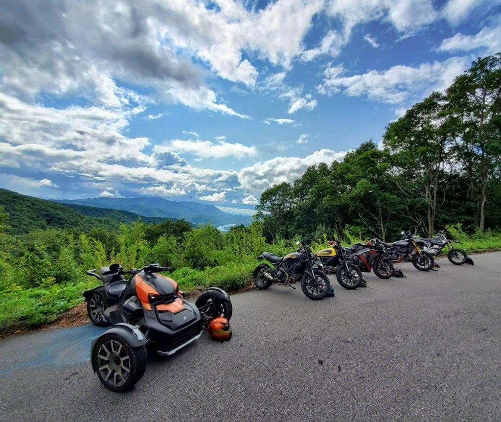 The Can-Am Ryker 900 Rally Edition parked next to other motorcycles