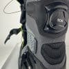 A Klim GTX Adventure boot with the BOA system tension released and the velcro flap opened.