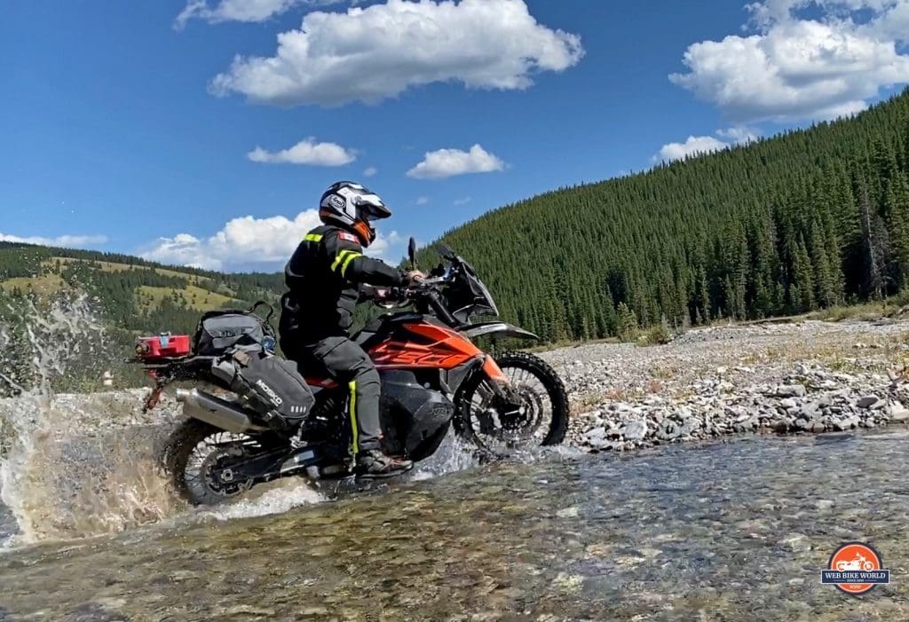 A KTM 790 adventure crossing a stream.