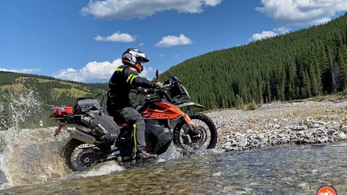 A KTM 790 adventure crossing a stream. A KTM 790 adventure crossing a stream.