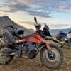 The Mosko Moto Reckless 80L V3.0 on a KTM 790 Adventure with a BMW R1200GS in the background.