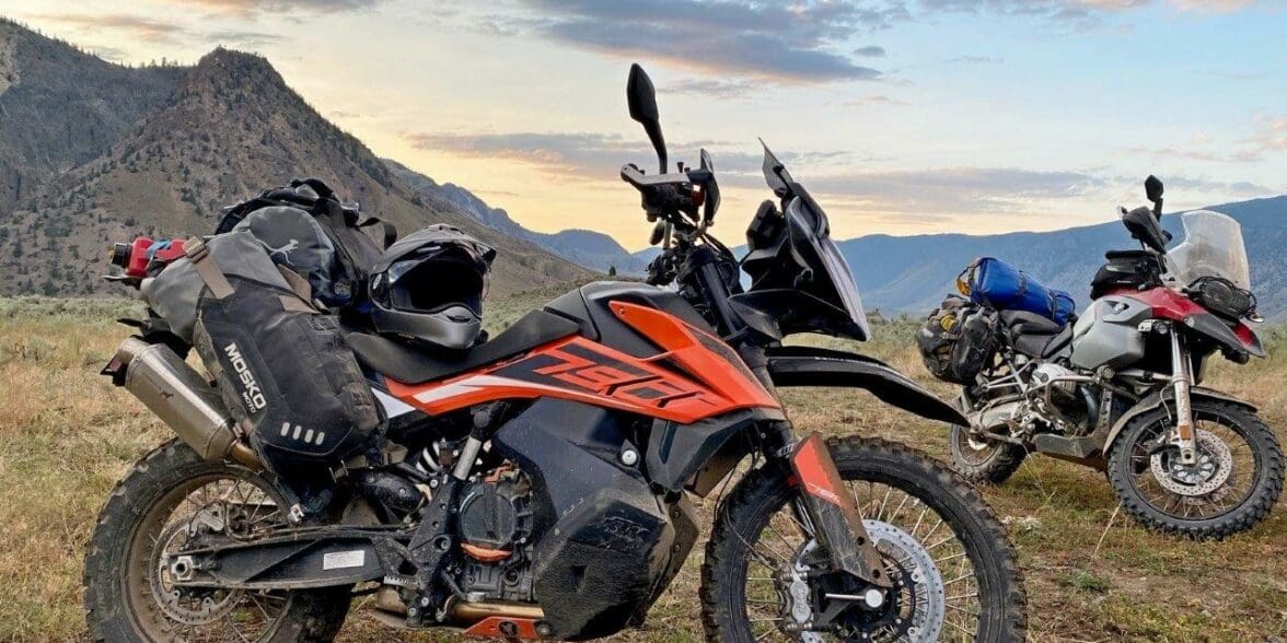 The Mosko Moto Reckless 80L V3.0 on a KTM 790 Adventure with a BMW R1200GS in the background.