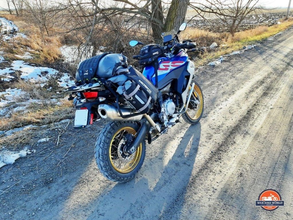A 2020 BMW F850GS Adventure parked on a country road with the Mosko Moto Reckless 80L v3.0 Revolver luggage installed.