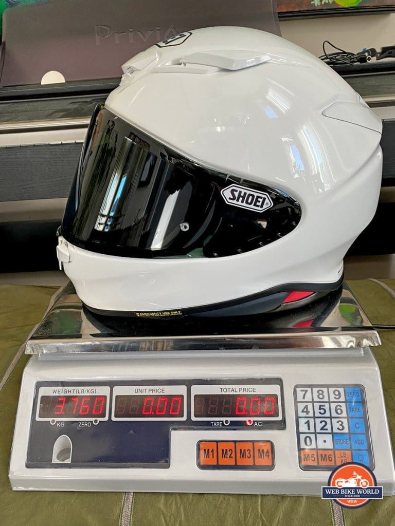 The Shoei RF-1400 on a scale showing 3.76lbs.