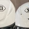 The upper vent in the open and closed positions on the Shoei RF-1400 helmet.