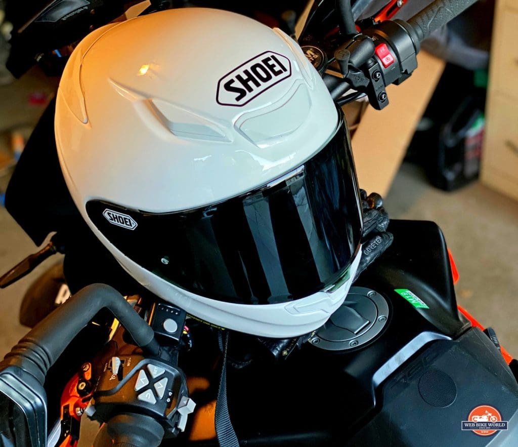 The Shoei RF-1400 helmet sitting on a KTM 790 Adventure.