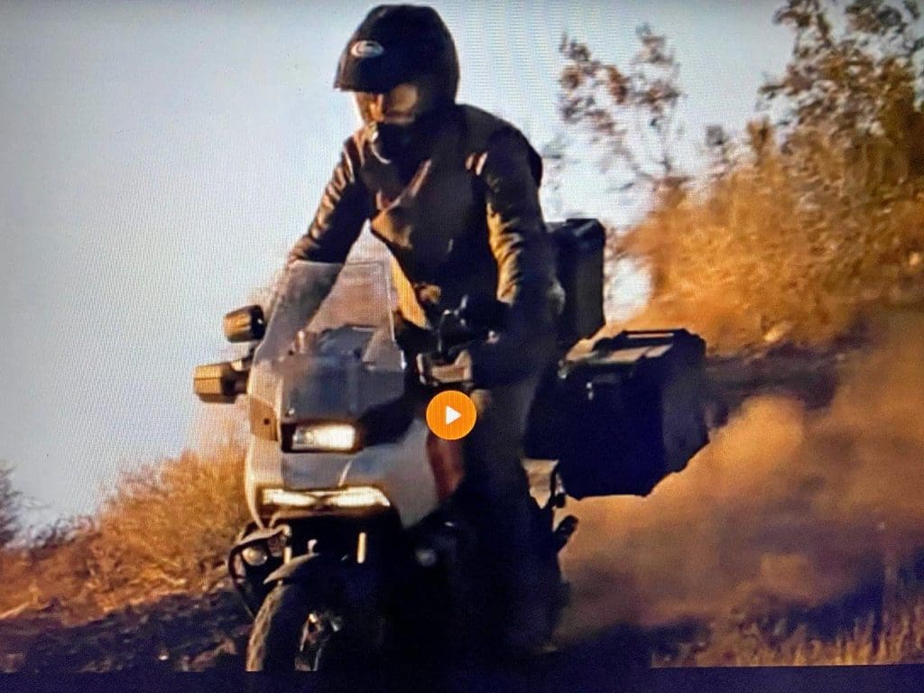 The Harley Davidson Pan America from the front showing its headlights.