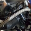 A closeup of a steel braided brake line on the Indian FTR 1200 S