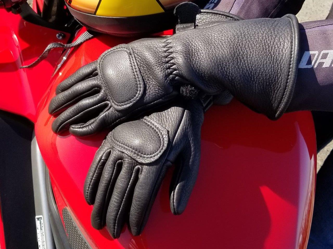 The Lee Parks Design Deersports gloves sitting on a Honda VFR800 gas tank.