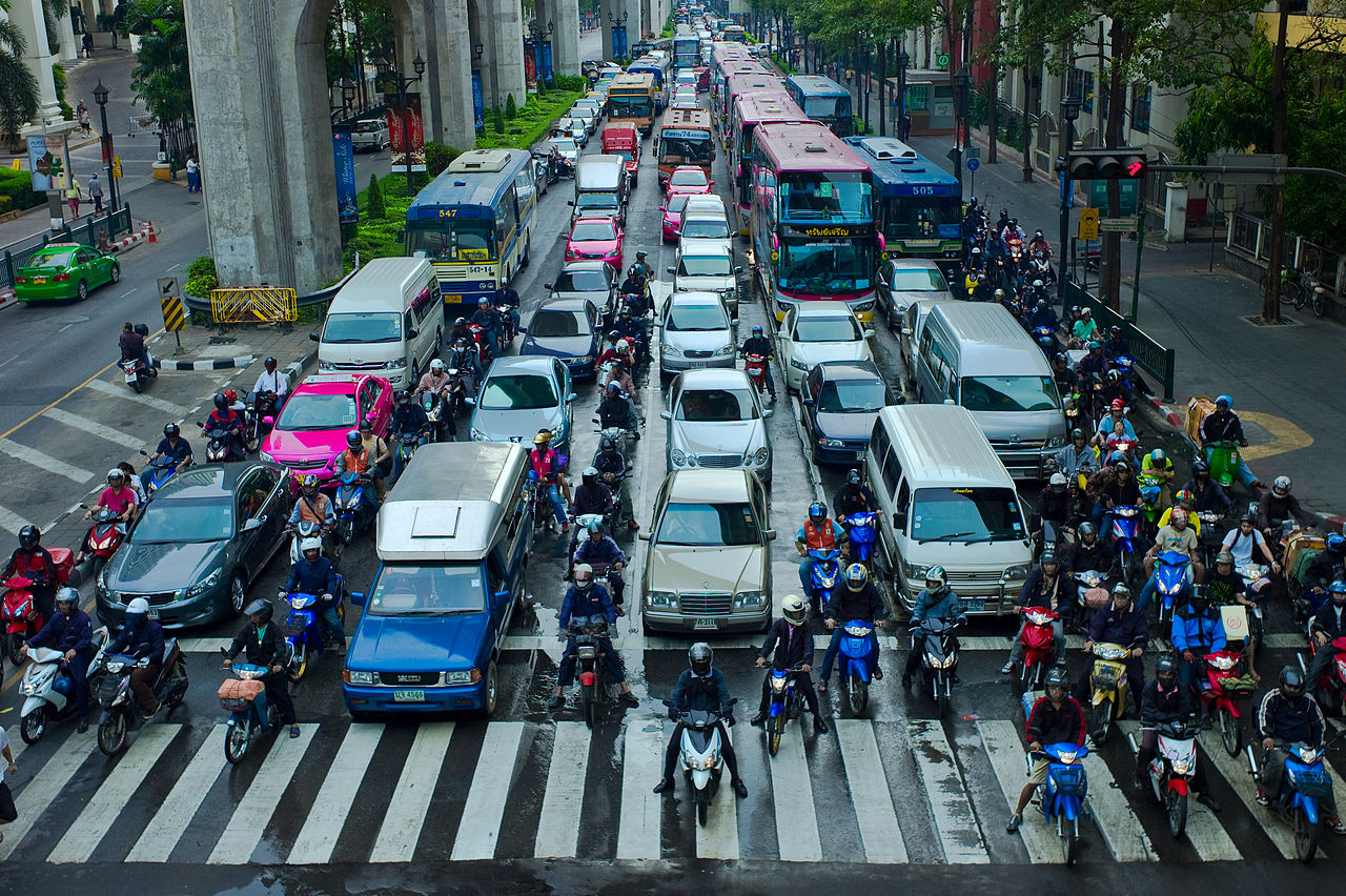 Motorcyclists lane filtering in Bangkok, Thailand