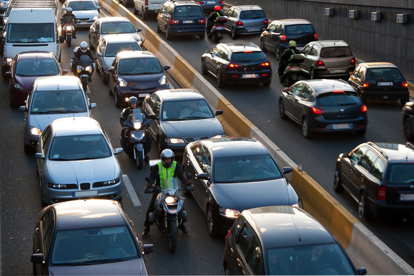 motorcyclists lane filtering in traffic